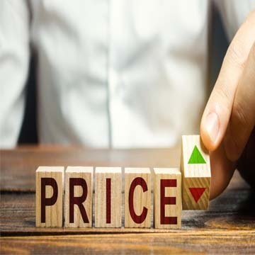 Wooden blocks spelling 'PRICE' with arrows.