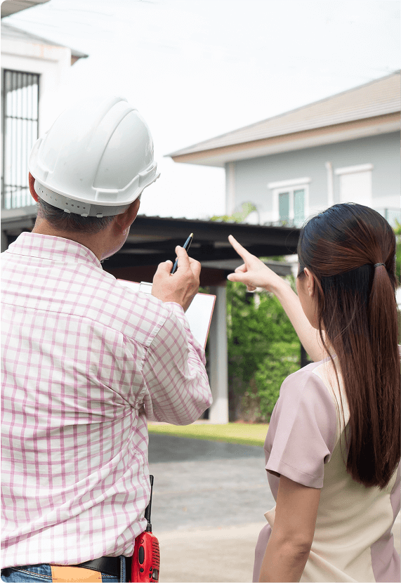 Man and woman discussing construction plans.